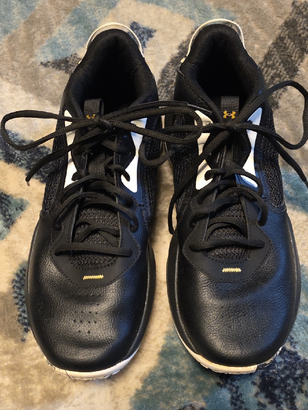 Under Armour Black Sneakers with White and Gold Accents